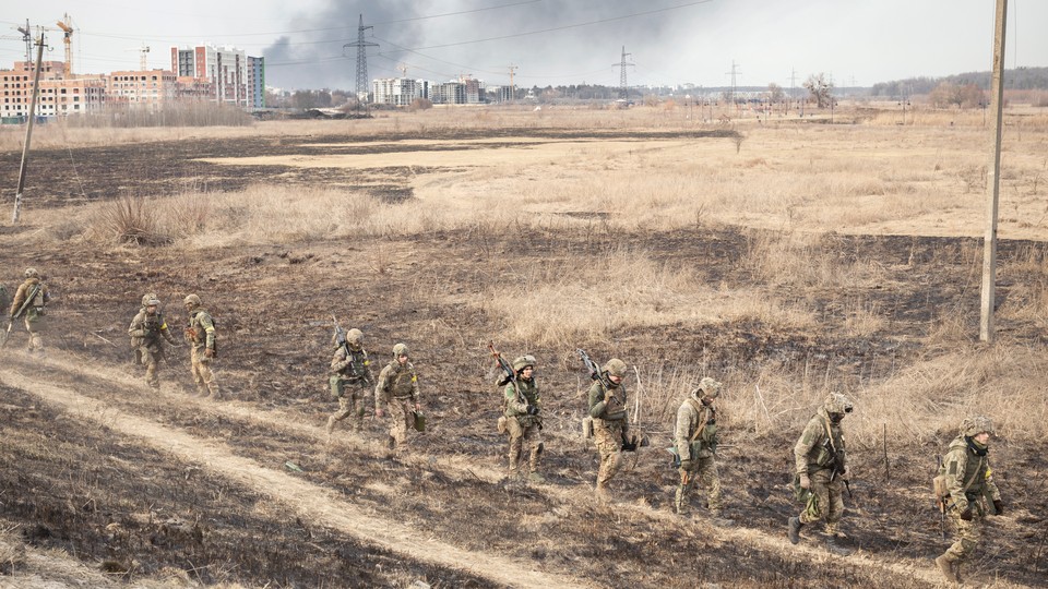 Ukrainian soldiers returning from the Irpin front line in March 2022
