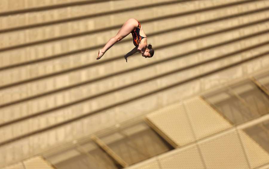 A diver is seen in midair during a dive.