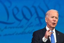 Photo of Joe Biden speaking with the backdrop of the U.S. Constitution