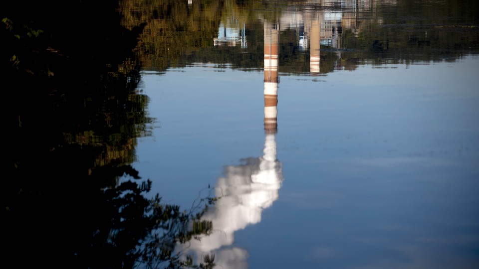 An upside-down reflection of a coal-fired power plant