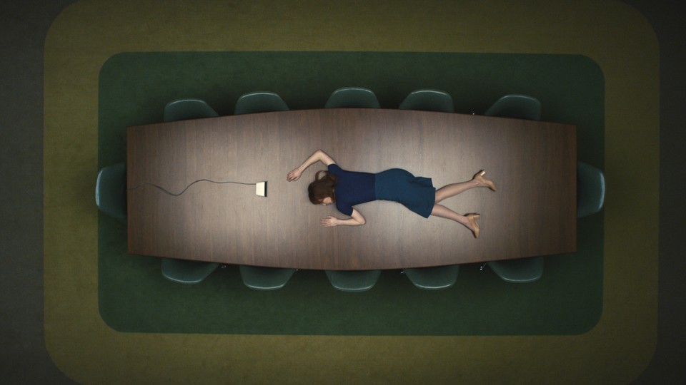 Still from "Severance" of a woman lying facedown on a conference table