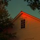 A yellow house at sunset