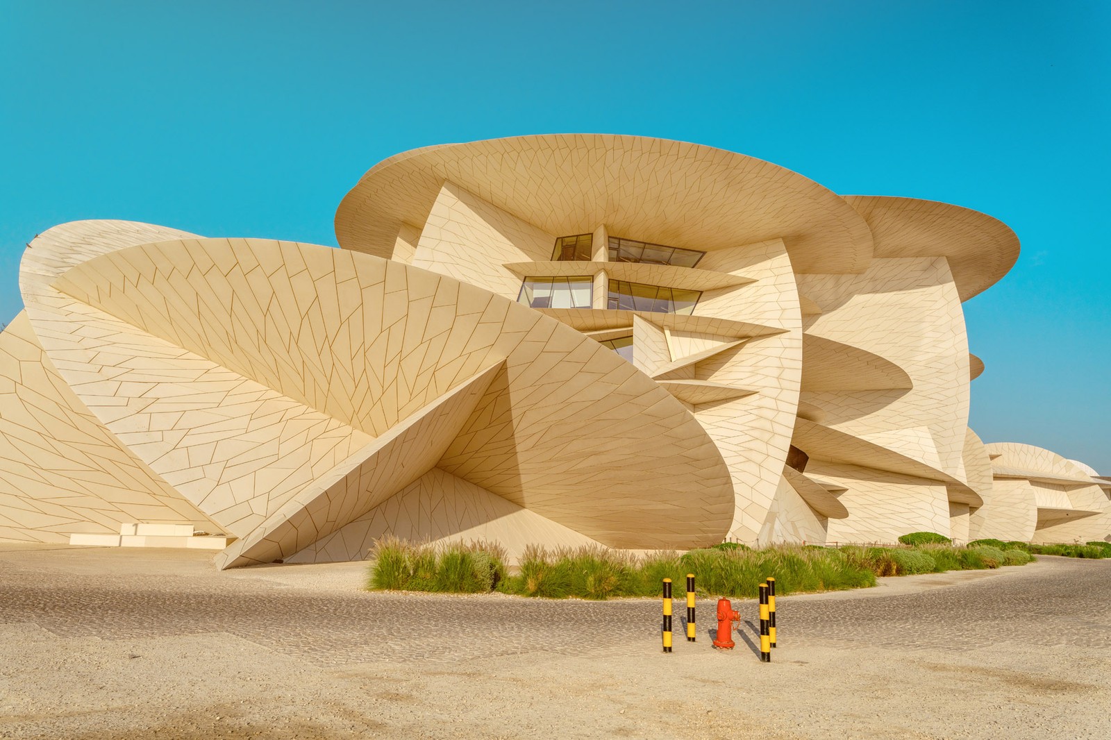 A view of the exterior of a modern museum, which has been built with many interlocking disc shapes.