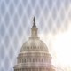The U.S. Capitol behind a fence.