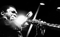 Black-and-white photo of John Coltrane performing