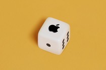 An image of a die with the Apple logo