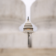 A view of the Capitol building from afar between pillars