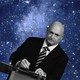 An illustration of Mark Kelly at a podium in front of stars.