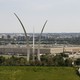 Aerial view of the Pentagon with the U.S. Air Force Memorial in the foreground and the Washington, D.C. skyline in the distance.