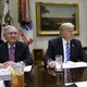 President Trump sits at a table with Paul Ryan and Mitch McConnell