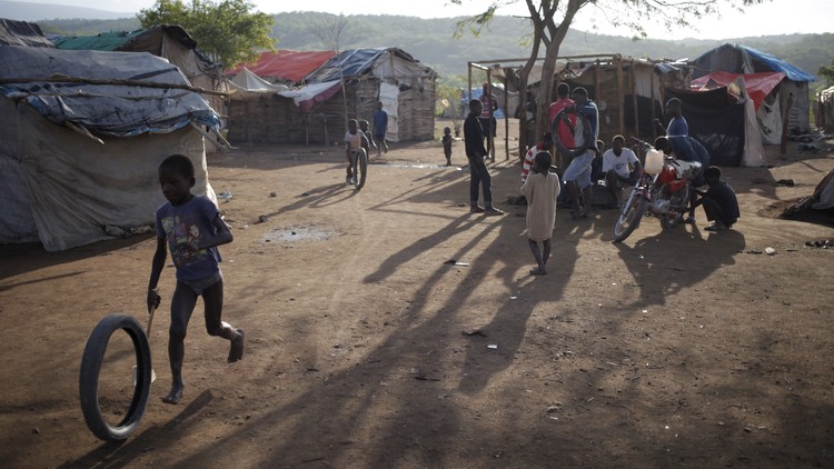 A boy plays at a refugee camp for Haitians returning from the Dominican Republic on the outskirts of Anse-a-Pitres, Haiti, September 7, 2015.