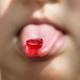 Photo of a gummy on a child's tongue