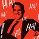 illustration with Gutfeld grinning in suit and tie on red background with white handwritten "HA!"s surrounding him