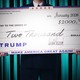 An illustration of a large $2,000 check dated "January 2026" and including "Make America Great Again" and Donald Trump's signature