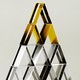 A pyramid of stacked credit cards, with gold ones at the top