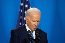 Photo of Joe Biden in front of microphones