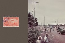 A red vintage stamp from Venezuela and a color photo of Caracas in 1948