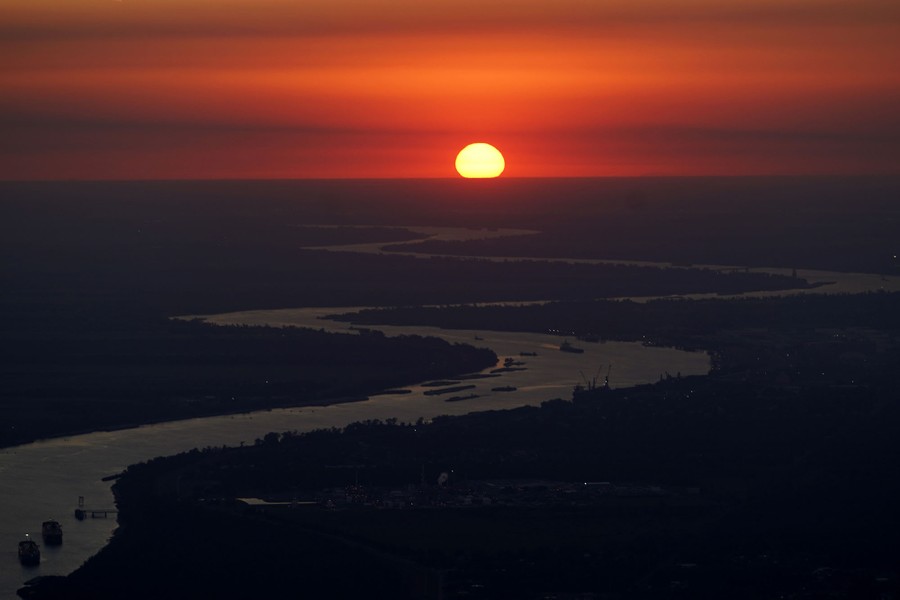 An aerial view of the sunset over a meandering section of the Mississippi River