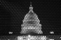 The Capitol building behind a fence