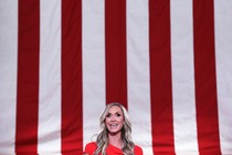 Lara Trump in front of a flag background