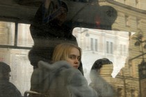 A young woman looks out a bus window in St. Petersburg, Russia.