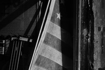 A black-and-white image of an American flag