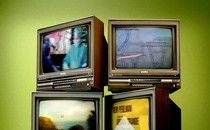 a set of TVs showing film clips about climate change