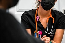 A worker at a Planned Parenthood in Florida checks the vitals of a woman who wants an abortion