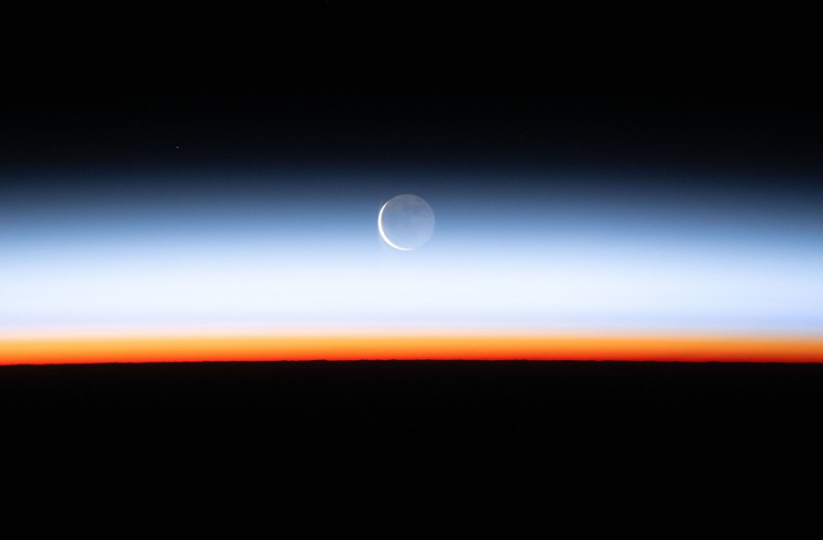 A moonrise, seen through the Earth's atmosphere.