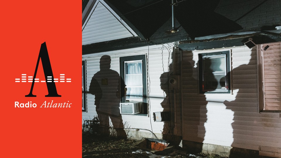 Shadows of ICE members projected on the outside of a home at night