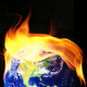 A photo-illustration of the Earth with flames in the shape of Donald Trump's hair.