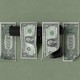 A handgun among dollar bills