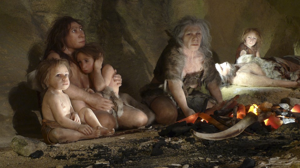 A painting of Neanderthal children and adults sitting near a fire