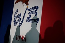 Shadows are seen on an Iowa flag during an event with Republican presidential candidate Florida Governor Ron DeSantis.