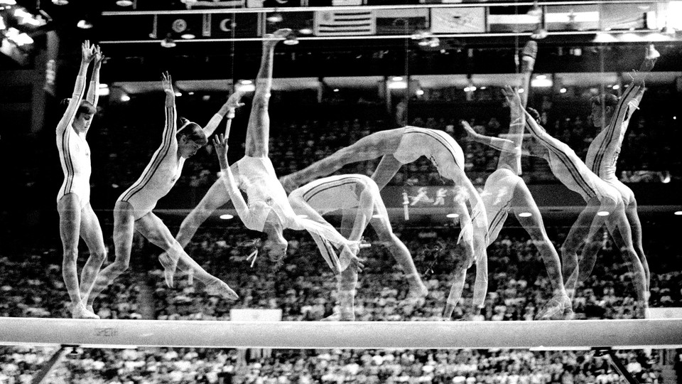 A series of freeze-frames of a gymnast performing a flip
