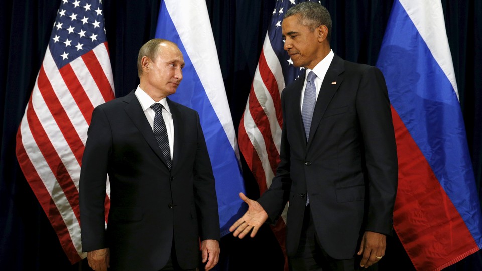 President Barack Obama extends his hand to Russian President Vladimir Putin during their meeting at the United Nations General Assembly in New York on September 28, 2015. 