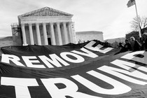 A photo of a banner outside the Supreme Court that reads: Remove Trump