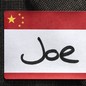An illustration showing a “Joe” name tag attached to a suit lapel.