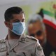 An Iranian border guard wears a mask.