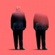 A gradually disappearing Donald Trump, seen from behind