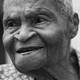 Black-and-white photograph of an elderly Black woman