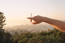 Picture of a man holding a cigarette in Paris, France