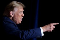 A photograph of Donald Trump pointing and talking