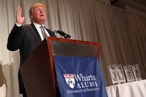 Donald Trump speaks at a podium