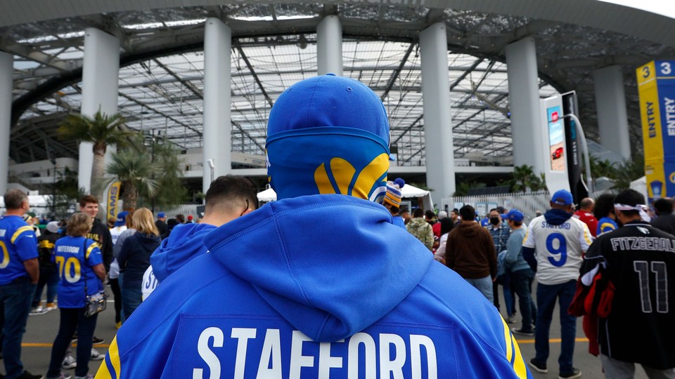 A Los Angeles Rams fan wearing a Matthew Stafford jersey