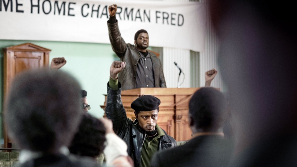 Daniel Kaluuya as Fred Hampton and Lakeith Stanfield as William O'Neal, with their fists raised