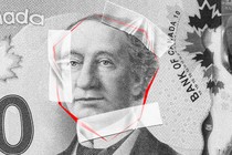 John Macdonald's likeness on the Canadian $10 bill, surrounded by red lines and tape