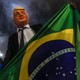 A supporter of Jair Bolsonaro wears a mask of Donald Trump as he celebrates after Bolsonaro won Brazil's presidential election on Oct 28, 2018