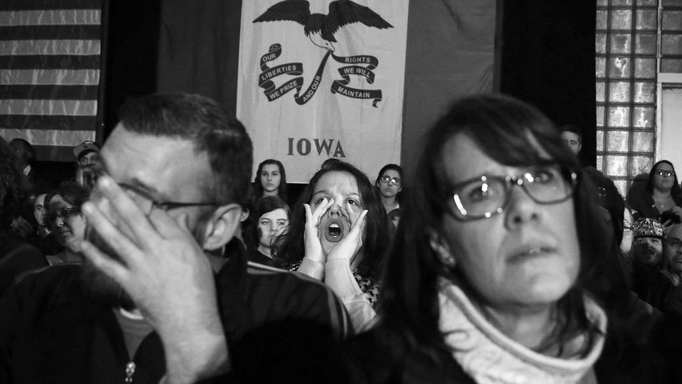 Frustrated voters standing in front of an Iowa flag