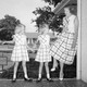A mom and her daughters pose in the front of their Southern California home in the early 1950s
